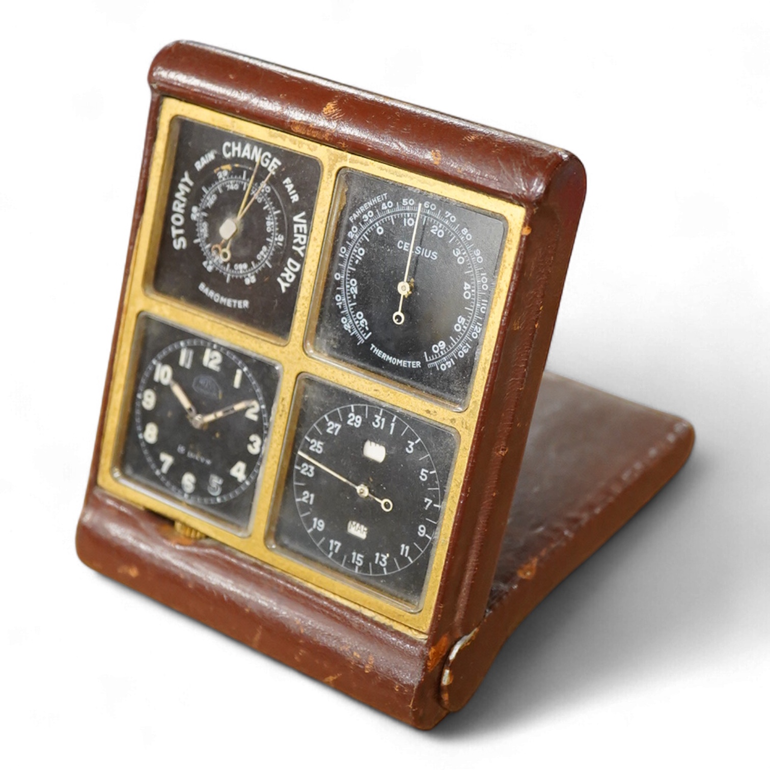 A mid-century Swiss leather cased travelling timepiece compendium with barometer, calendar and thermometer retailed by Ross, 10cm h